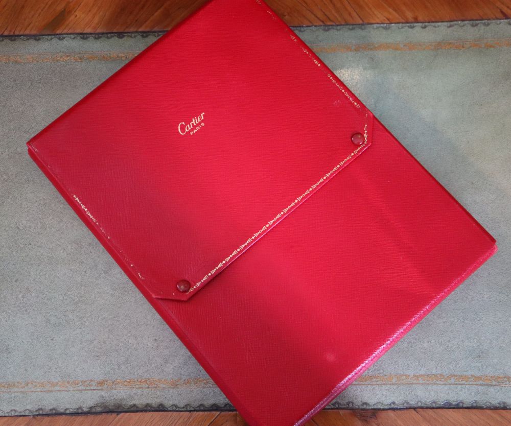 A Cartier Paris gilt tooled red leather necklace box, 26.3cm.